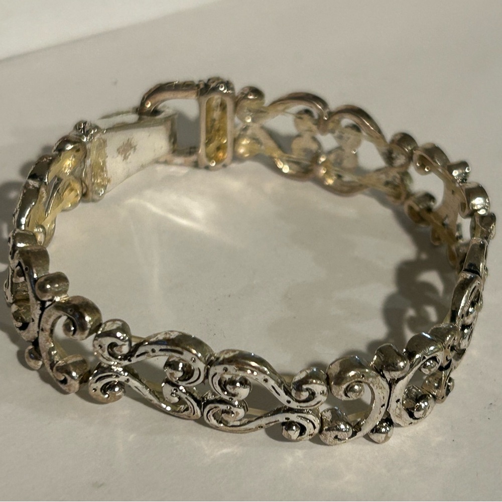 Ornate Silver Filigree Bracelet with Secure Clasp